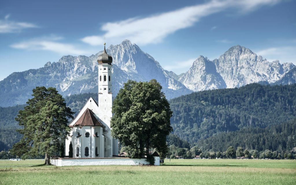 St Coloman Church in Southern Germany in front of the Bavarian Alps