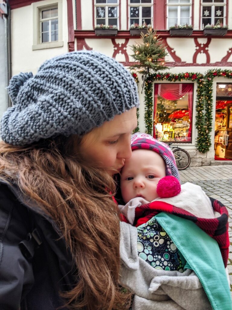 mother kissing baby during a rothenburg winter