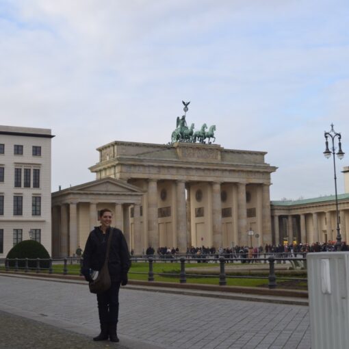 LeAnna Brown, Germany travel specialist standing in front of Berlin's Brandenburg Gate