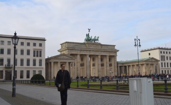 LeAnna Brown, Germany travel specialist standing in front of Berlin's Brandenburg Gate