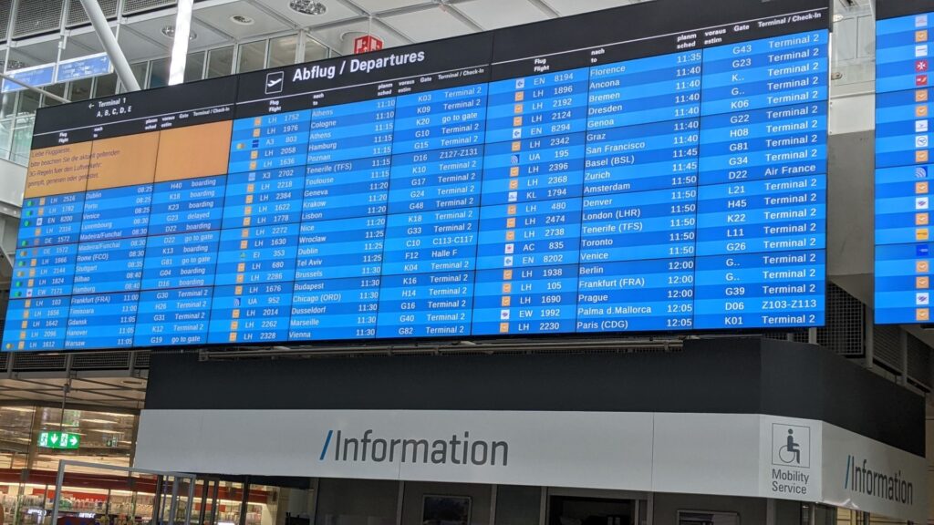 munich airport flight times on a departure board