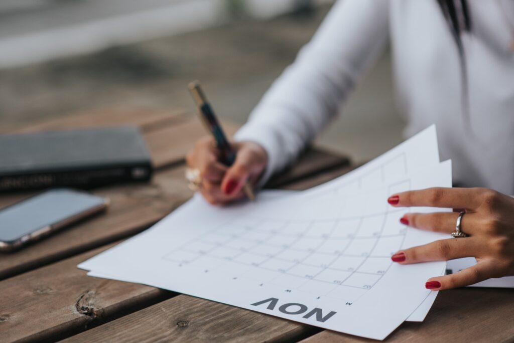 lady writing on a calendar