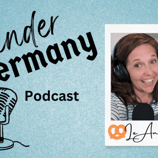 Blue background with black text of Wander in Germany Podcast with photo of LeAnna Brown wearing headphones and smiling